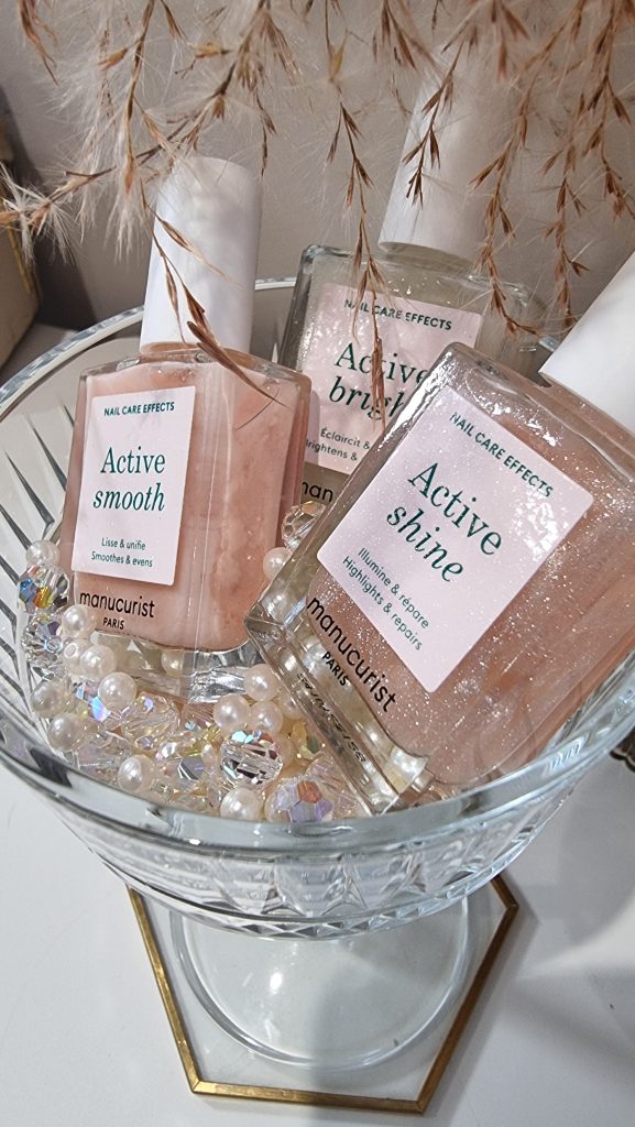 Manucurist vegan nail polish Active Smooth, Active Bright and Active Shine in a champagne glass